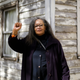 In this April 6, 2017, photo Rhea McCauley, a niece of Rosa Parks, poses in front of the rebuilt house of Rosa Parks in Berlin. McCauley donated the former Detroit house of Parks to American artist Ryan Mendoza, who took apart the Michigan house Parks once lived in and rebuilt it in the German capital to raise awareness about the late civil rights activist and her legacy. (Markus Schreiber/AP Images)